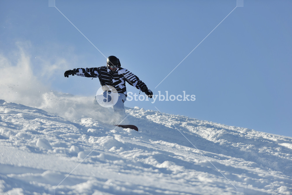 Freestyle snowboarder jump and ride